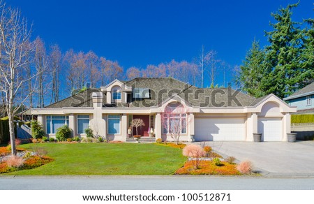 Custom built and nicely landscaped luxury house in a residential neighborhood. Vancouver. Canada.