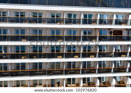 Fragment of the cruise ship side with a large amount of  berths ( cabins )