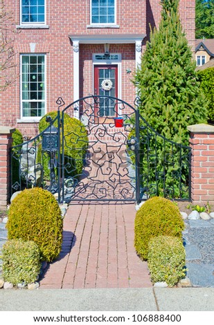 Paved entrance to the big luxury house.