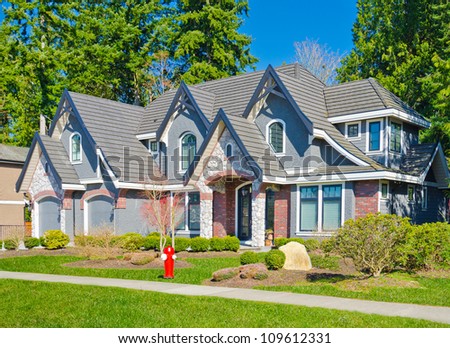 Custom built big luxury house with double doors garage in a residential neighborhood. Suburbs of Vancouver ( Surrey ) Canada.