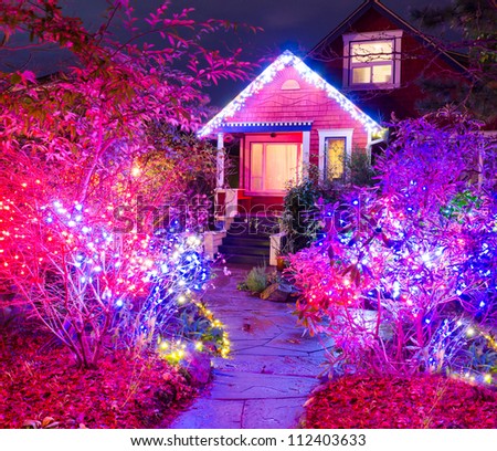 Home decorated and lighted for Christmas and for New Year Eve at Night at Vancouver, Canada.