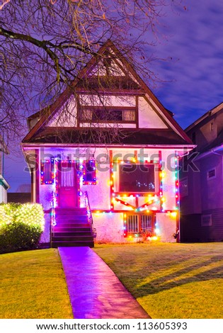Home decorated and lighted for Christmas and for New Year Eve at Night in Vancouver, Canada.