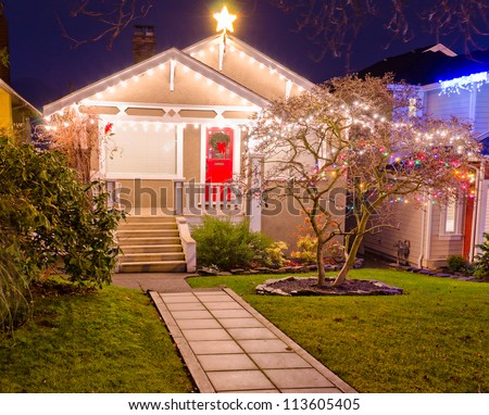 Home decorated and lighted for Christmas and for New Year Eve at Night in Vancouver, Canada.