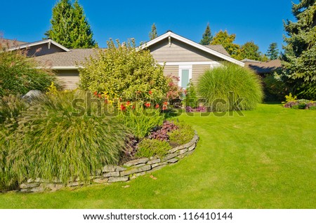 Nicely trimmed and designed front yard lawn in the suburbs of Vancouver, Canada. Landscape design.