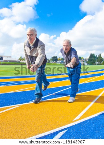 Two elderly, retired men on the runway posing to start, run.