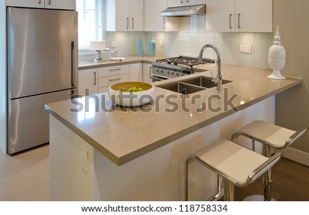 Luxury Modern Kitchen With The Dish With Some Pears On The Counter. Interior Design