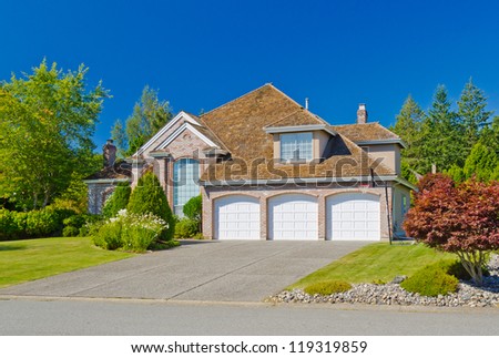 Big custom made three garage doors luxury house in the suburbs of Vancouver, Canada.