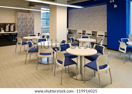 Interior of modern company lunchroom where employees can have their break.