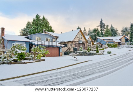 Nice neighborhood in cold,chilly and frosty winter time covered with snow . Vancouver, Canada.