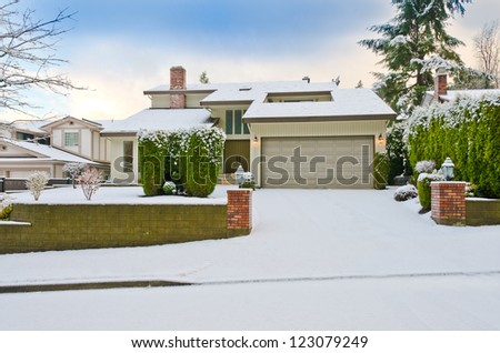 House in cold,chilly and frosty winter time covered with snow . Vancouver, Canada.