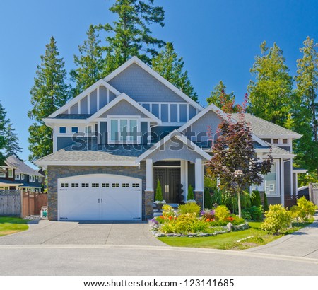 Big custom made double doors garage luxury house in the suburbs of Vancouver, Canada.