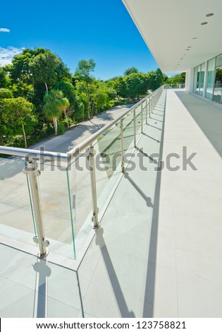 Perspective of the modern glass and steel balcony, deck railing. Exterior, interior design.