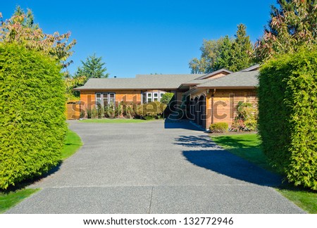 Big custom made luxury house with wide and long driveway in the suburbs of Vancouver, Canada.