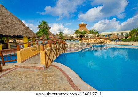 Bridge over the swimming pool at the luxury mexican resort. Bahia Principe, Riviera Maya.