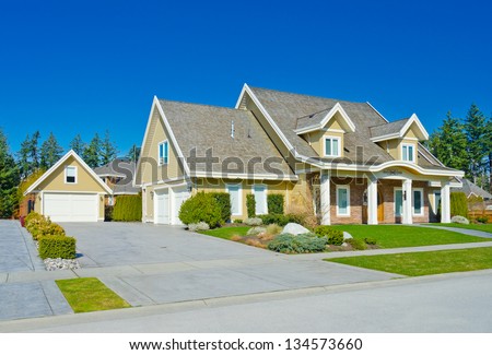 Big custom made  luxury house with double doors garage and the separate one in the suburbs of Vancouver, Canada.