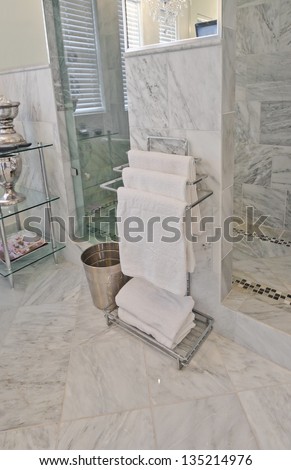 White spa towels hanging in the bathroom, washroom. Interior design.