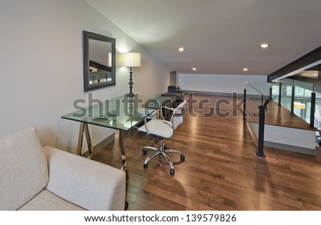 Luxury spacious modern nicely decorated den, home office in an  attic. Interior design. Vertical.