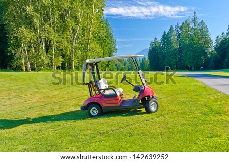 Great view (panorama, outlook ) at the beautiful golf course with the golf cart.
