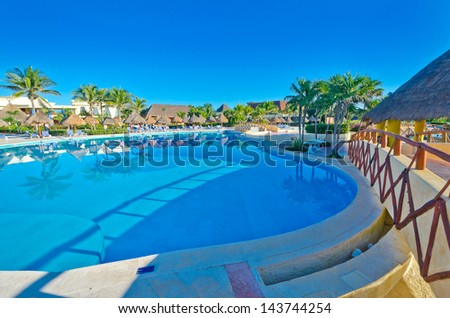 Swimming pool at the luxury mexican resort. Bahia Principe, Riviera Maya.