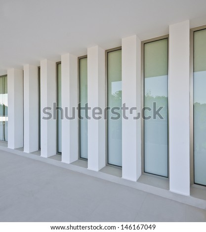 Outlook, prospect, perspective of the windows on white. Fragment of the office, building hall, lobby, doors and windows. Interior, exterior design.