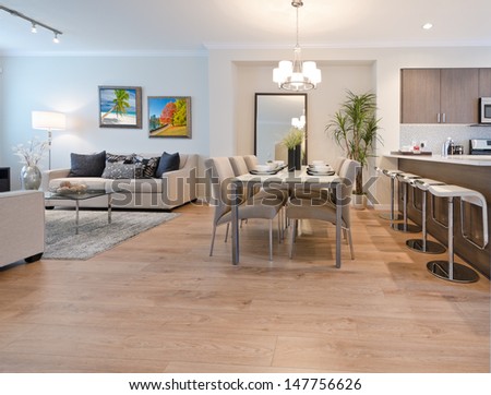 Luxury And Nicely Decorated Living Set, Lunch Room With The Table With The Coffee, Tea Set And The Living Suite, Room And The Kitchen Aside . Interior Design.