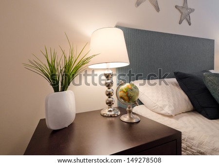 Decorative Vase, Night Lamp And Globe On The Night Stand Table In Bedroom. Interior Design.