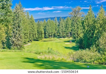 Panorama, outlook at the gorgeous golf course with a mountains and dark blue sky. Vancouver, Canada.