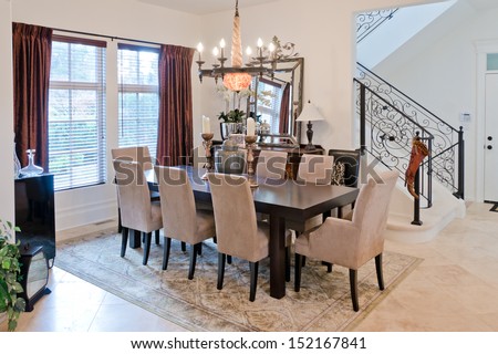 Nicely decorated luxury living ( lunch ), dining room. Dining table and some chairs. Interior design.