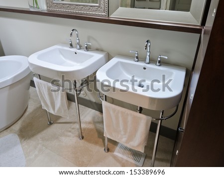 Two sinks in  the luxury modern bathroom with marble floor.  Interior design.