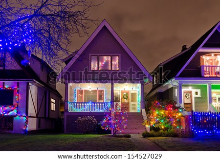 House decorated and lighted for Christmas and for New Year Eve . Night in Vancouver, Canada.