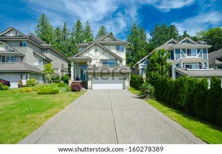 Luxury house with double doors garage and wide and long driveway. Vancouver, Canada.
