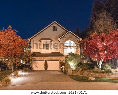 Big luxury house at night, disk, sunset, sunrise time in suburbs of Vancouver, Canada.