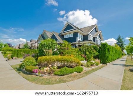 Nice and comfortable neighborhood. Some homes with nicely landscaped front yards in the suburbs of Vancouver, Canada.