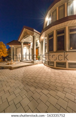 Fragment of the big luxury house at night, disk, sunset, sunrise time in suburbs of Vancouver, Canada.