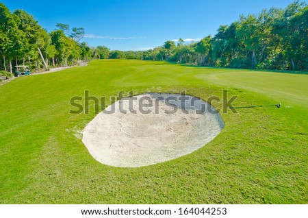 Sand bunker on the beautiful golf course. Mexican resort. Bahia Principe.  Riviera Maya.