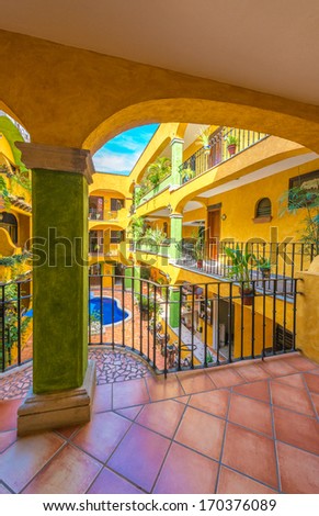 Traditional colonial style inner court, plaza, yard of luxury caribbean, mexican hotel with the swimming pool.