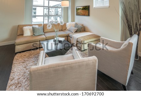 Luxury modern living suite, room with sofa and chairs.  Interior design of a brand new townhouse.