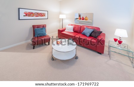 Luxury Living Suite. Nicely Decorated Modern Family, Living Room With Red Color Leather Couch, Chair And Coffee Table. Interior Design.