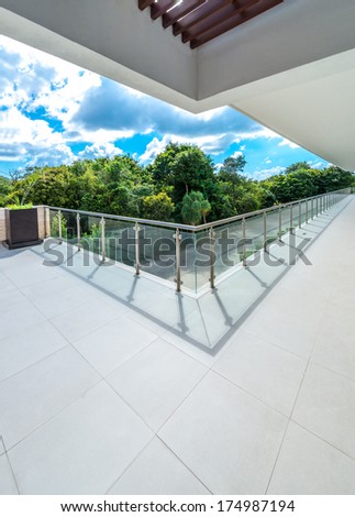 Perspective of the modern glass and steel balcony, deck, patio, promenade railing. Exterior, interior design.