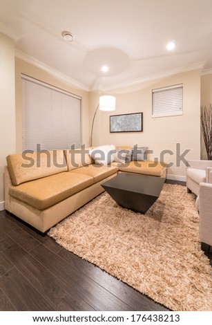 Luxury modern living suite, room with sofa and chairs.  Interior design of a brand new house.