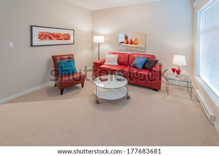 Luxury Living Suite Of Brand New Townhouse. Nicely Decorated Modern Family, Living Room With Red Color Leather Couch, Chair And Coffee Table. Interior Design.