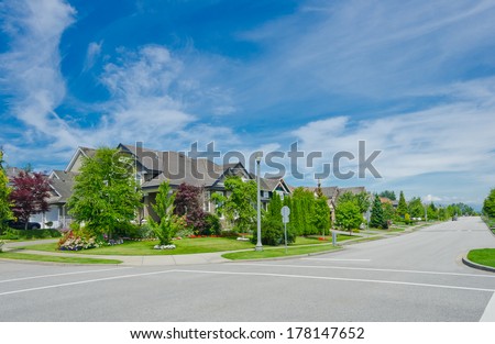 Great and comfortable neighborhood. Line, row of the houses on empty street in the suburbs of Vancouver, Canada.