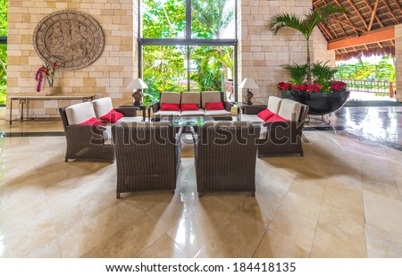 Fragment of the lobby, lounge area with some chairs and table of five stars luxury caribbean resort hotel. Interior design. Bahia Principe, Riviera Maya, Mexico.