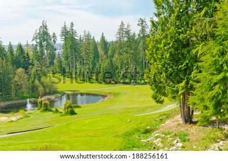 Panorama, outlook at the beautiful golf course in a sunny day with dark blue sky and clouds. Canada, Vancouver.