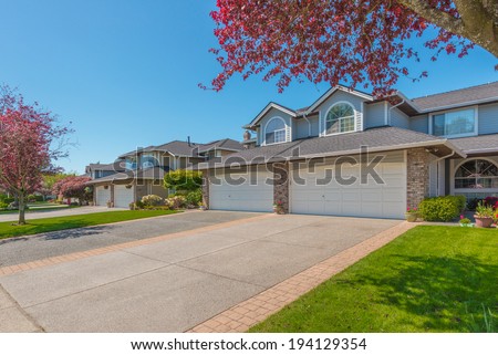 Nice and comfortable neighborhood. Some homes on the empty street in the suburb of North America. Canada.