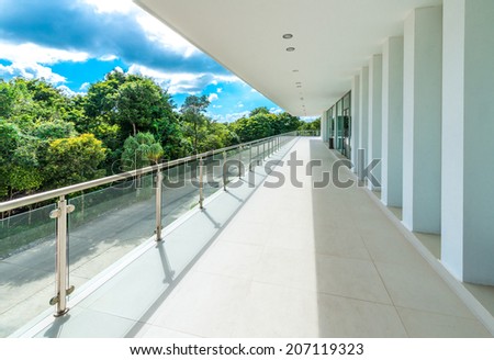 Perspective of the modern glass and steel balcony, deck, patio, promenade railing. Exterior, interior design.
