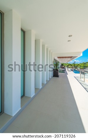 Perspective of the modern glass and steel balcony, deck, patio, promenade railing. Exterior, interior design. Vertical.