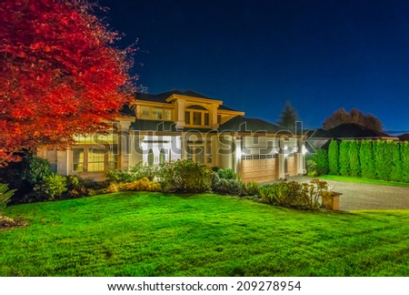 Big luxury house at night, disk, sunset, sunrise time in suburbs of Vancouver, Canada.