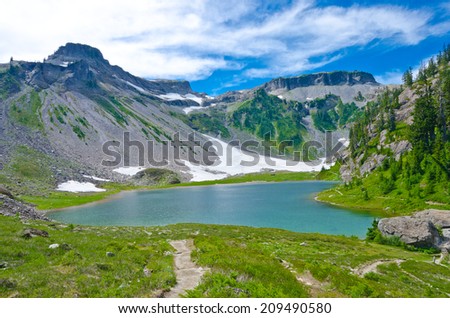 Gorgeous view at the valley with lake and snow at mountain lands and wilderness. North America.
