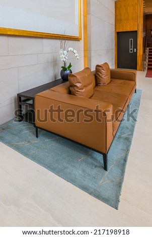 Lounge area of a hotel, club, company lobby. Fragment of the modern lobby of the  hotel.  Interior design. Vertical.